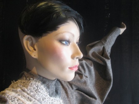 A Darker Eden face and feather headpiece