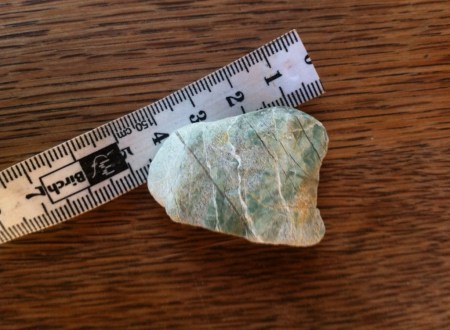 green rock measuring tape