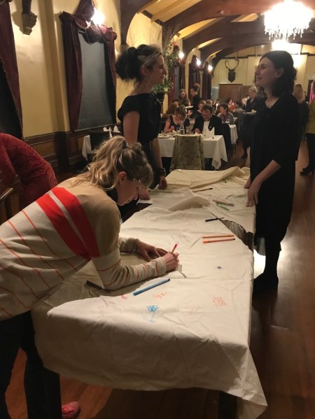 Heidi signing and coversation over the cloth low res