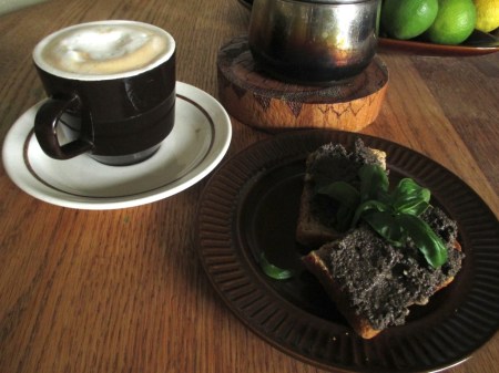 Tapenade on toast and coffee close