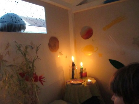 Luna's party candles in the play house with Blake